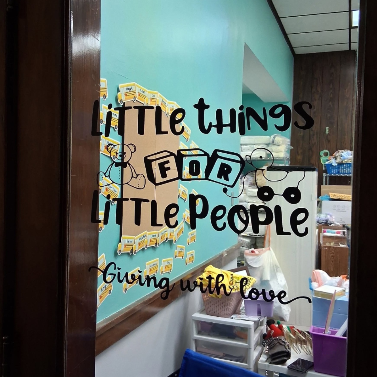 Window from door showing little things for little people logo